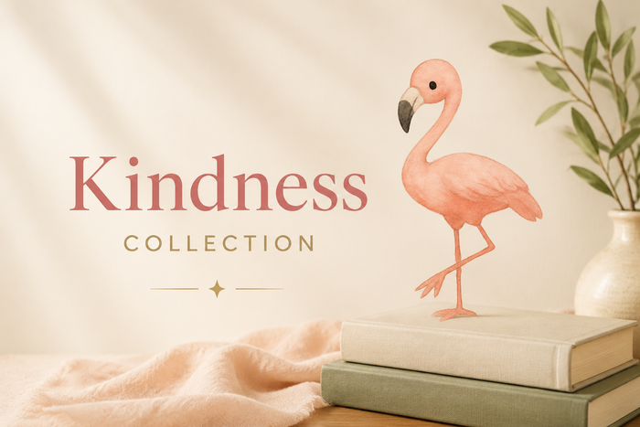 Kindness Collection hero image with Hope, a soft pink flamingo, standing on a warm, softly lit surface next to a small stack of books. Minimal text shows the title ‘Kindness Collection.’