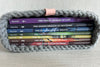 Set of books titled Seven Deadly Dragons book series in a woven bible journal cover on a light background