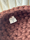 Close-up showing Verity Wells tag stitched into handmade Formation Nest.