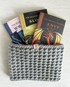 Seven Deadly Dragons virtue book set with prayer card, WonderGuide™, and ‘Pray to Slay’ bracelet on gray textured background.