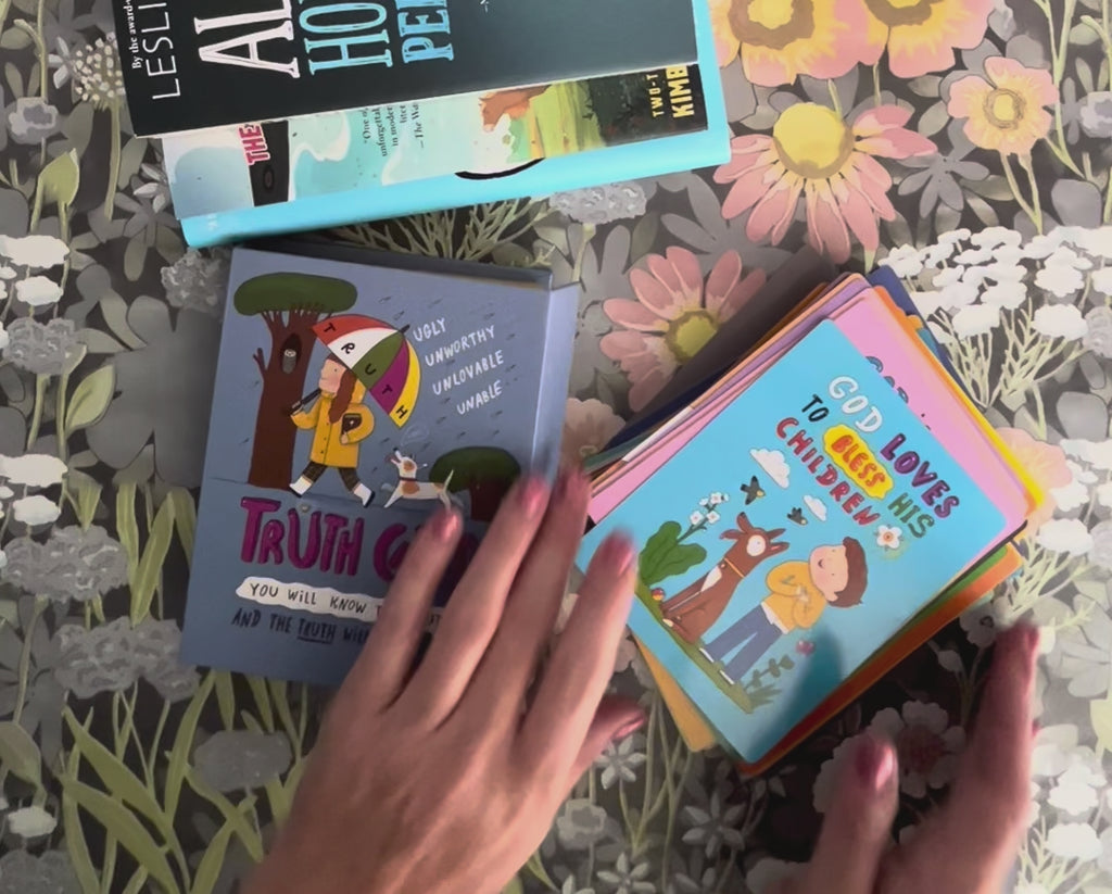 Hands flipping through 52 Truth Cards for kids, revealing encouraging affirmations and scripture-based truths designed to replace lies with God’s word. Includes a close-up of the magnetic closure box and several sample cards being read aloud.